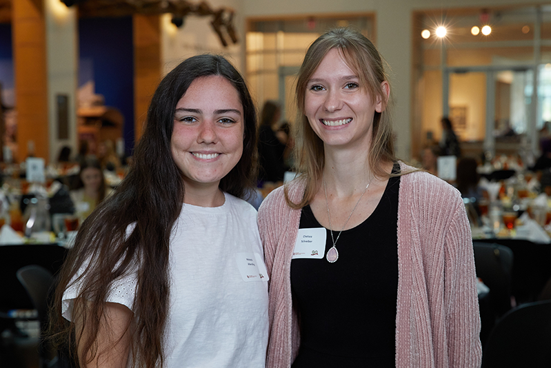 Two students smiling at scholarship luncheon