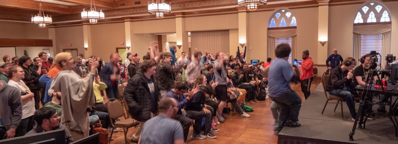 Students cheering on competitors in the Molly Shi Ballroom in the OU Memorial Union at Super Bit Wars 6 in 2018.