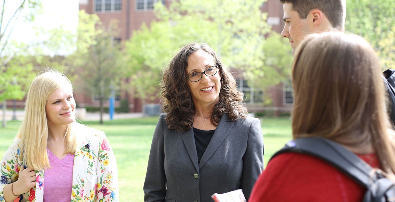 Dr. Campbell talking to students.