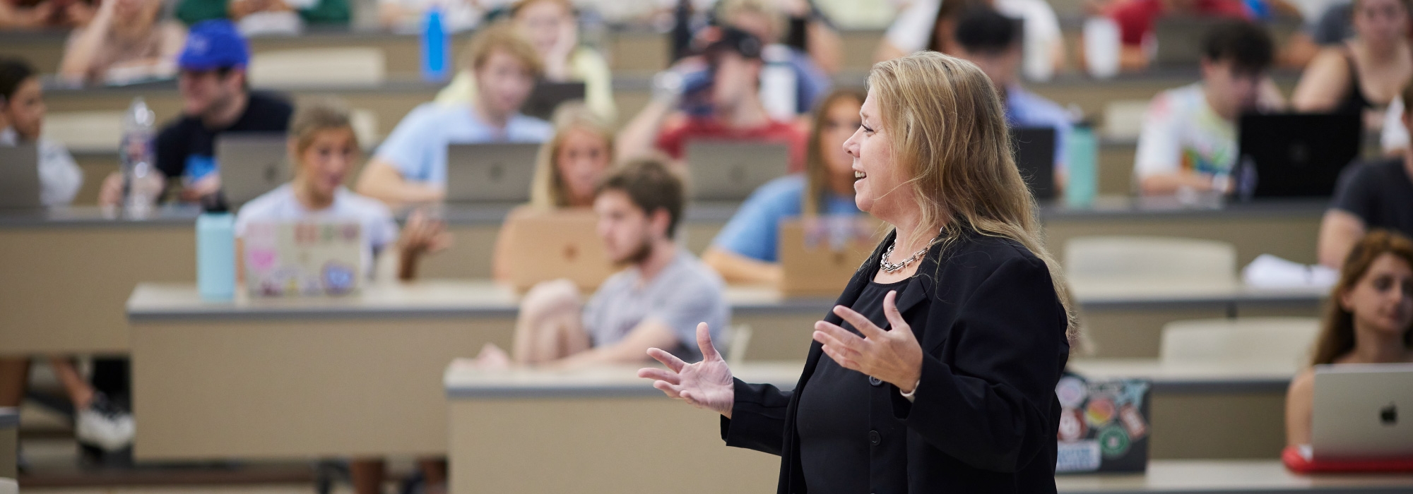 OU professor lecturing to students.