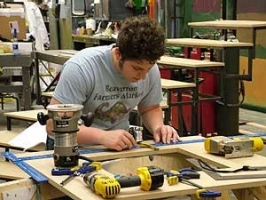 students uses the scene shop for a set design wood working project