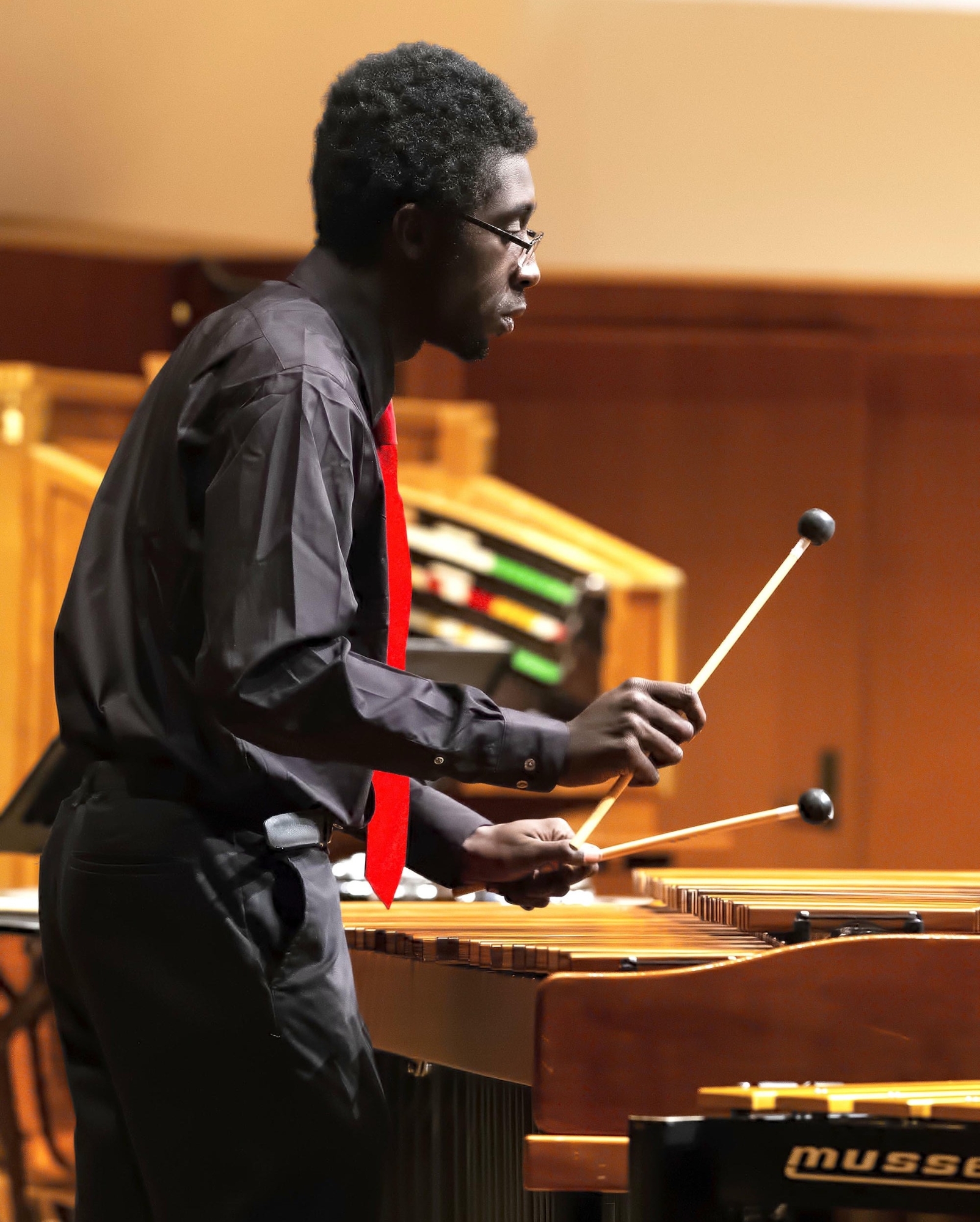 OU Percussion student performs on xylophone in Sharp Hall - close up photo.