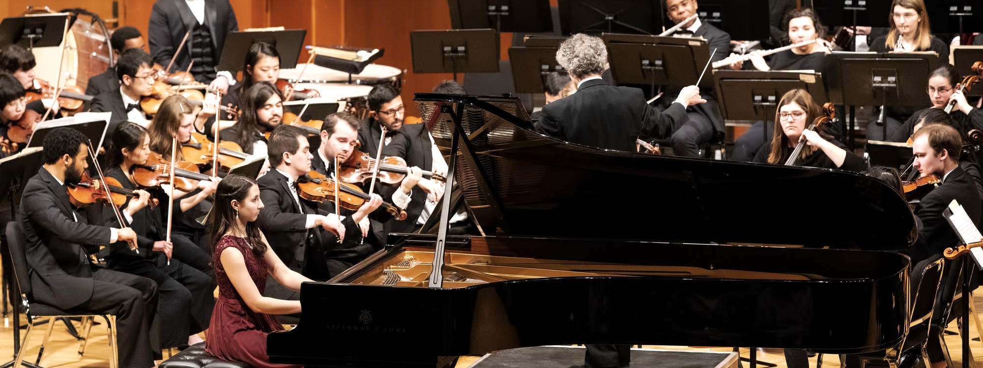 Pianist performing concerto with OU Symphony Orchestra.