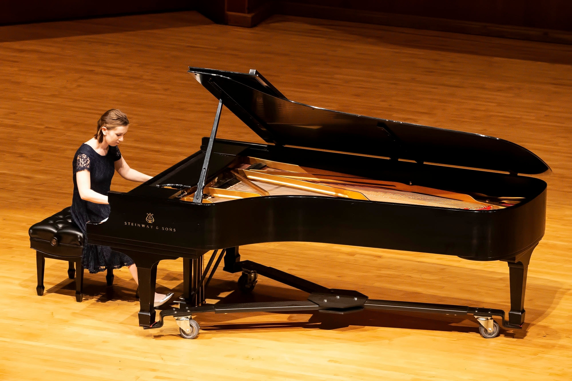 Piano student performs solo piano piece in Sharp Hall.