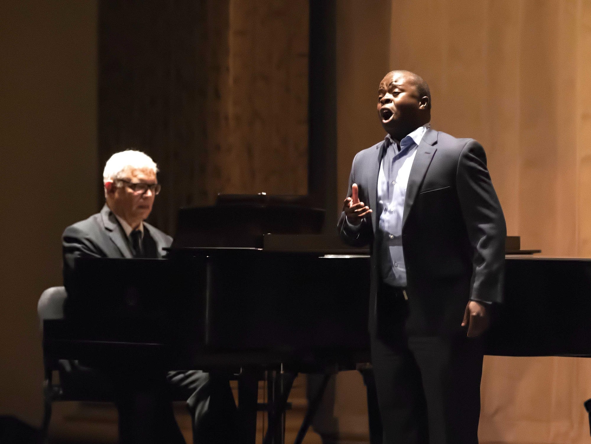 Vocal student performing solo with piano accompaniment.