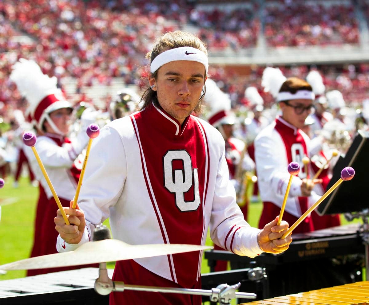 Pride of Oklahoma front ensemble member performing halftime.