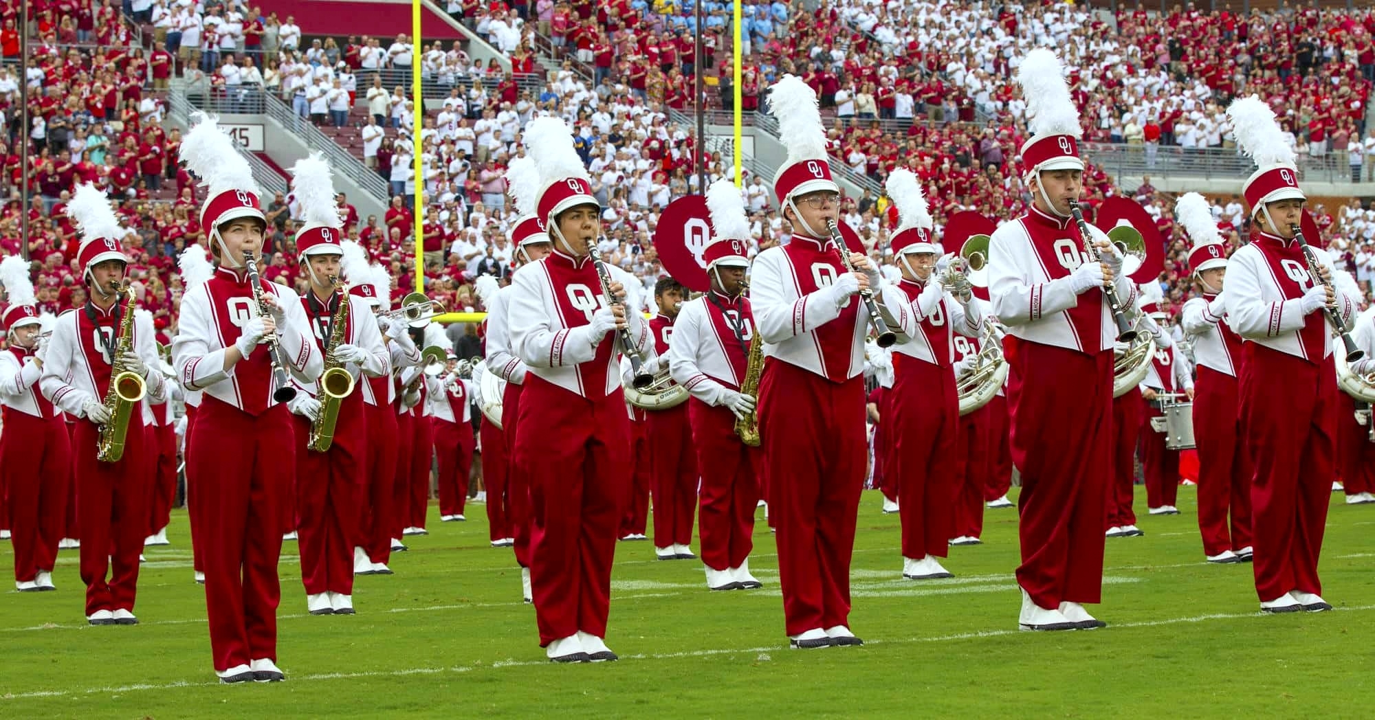 Halftime performance photo of Pride of Oklahoma Clarinets on field