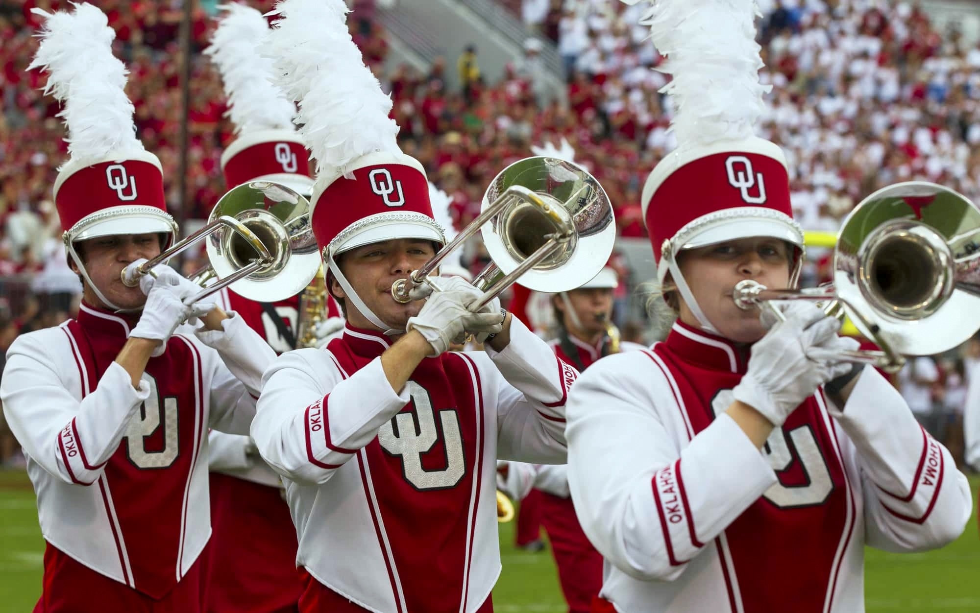 Halftime performance photo of Pride of Oklahoma Trombones on field