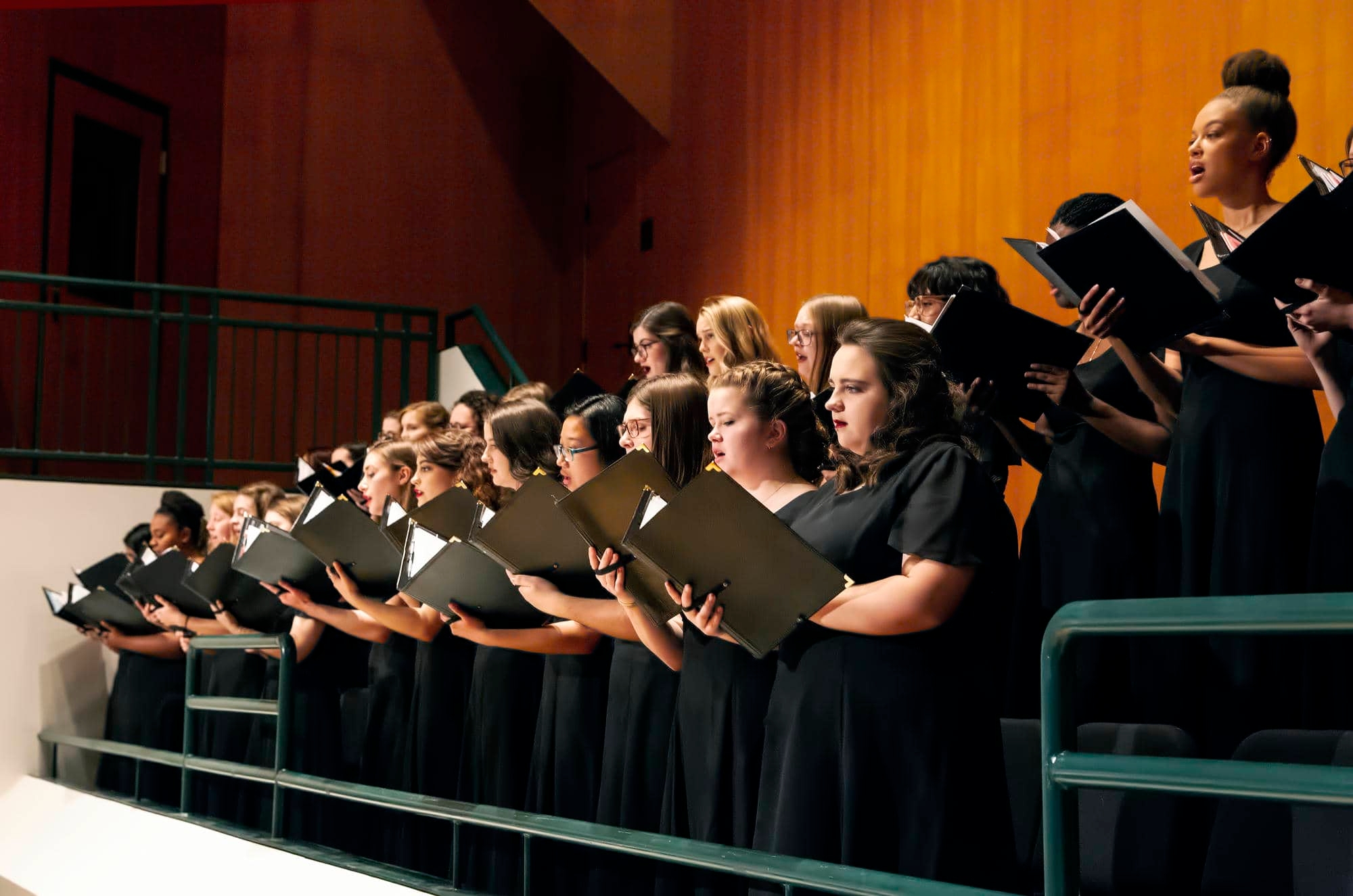 Women's chorus performs in sharp hall balcony