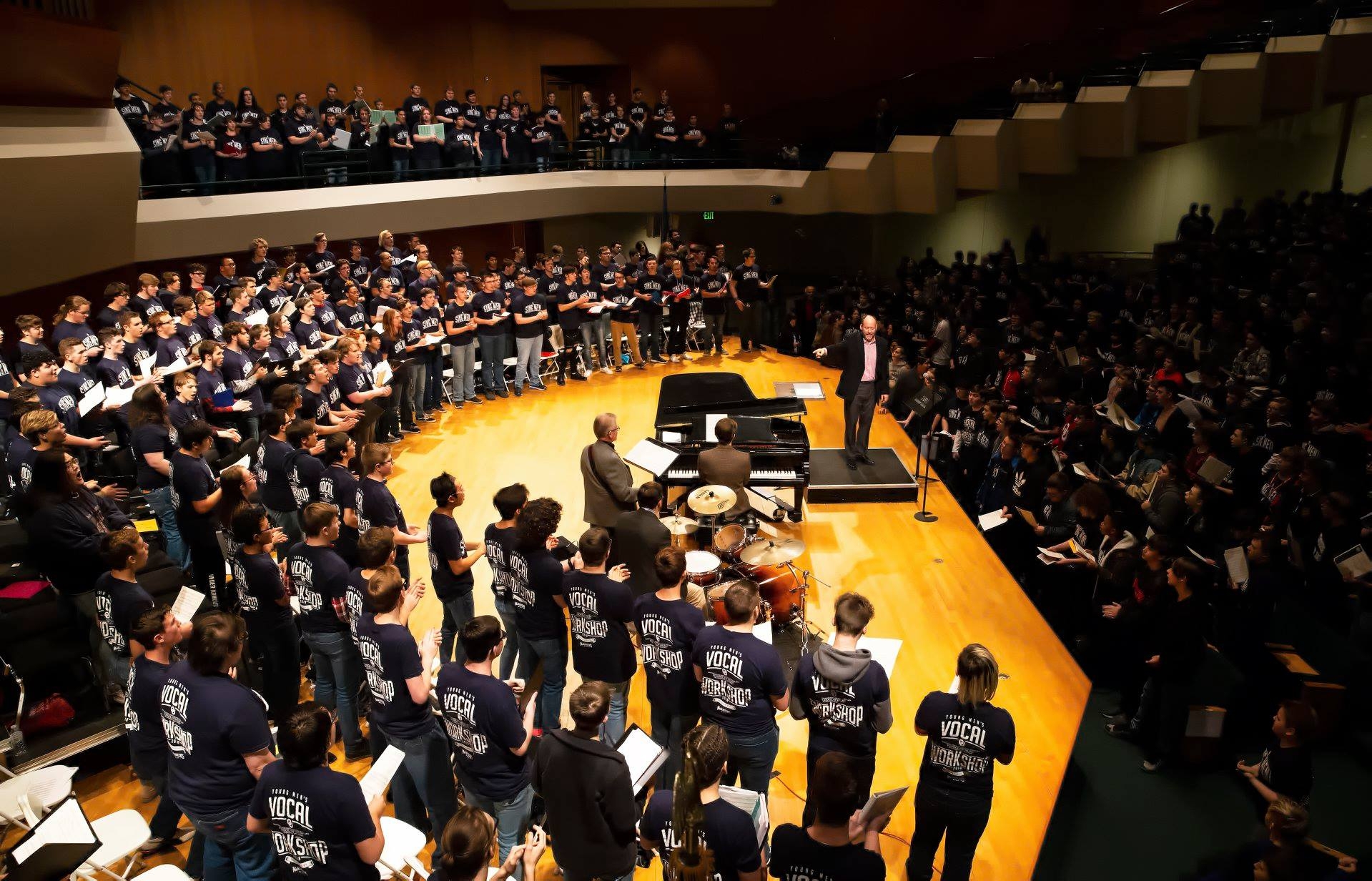 Performance photo of combined men's choir at past OU Vocal Workshop.