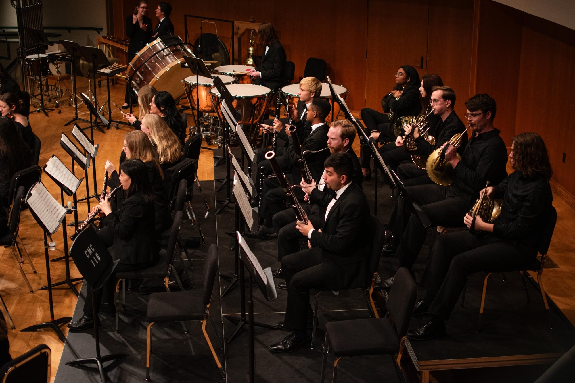 OU Symphony Orchestra performing in Sharp Hall. Closeup of winds and horns.