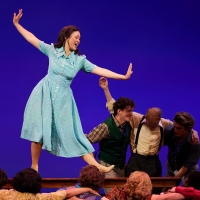 Student posing in blue dress in Crazy For You.