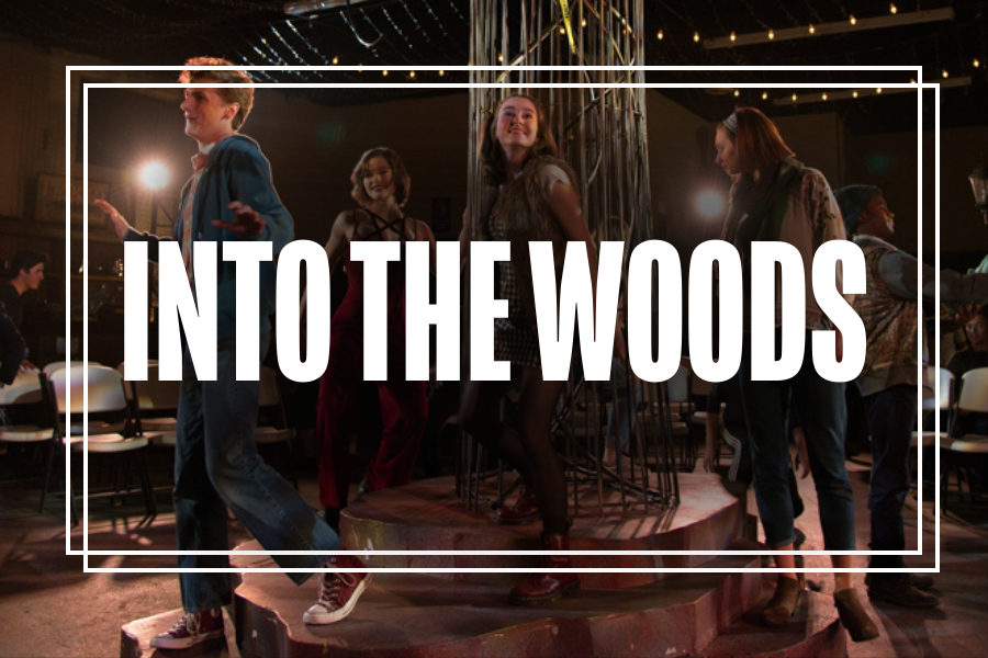"Into the Woods" in white text overlaying a photo of Musical Theatre students performing.