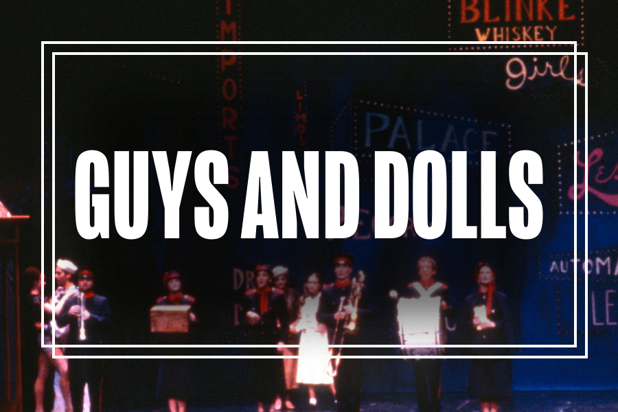 "Guys and Dolls" in white text overlaying a photo of Musical Theatre students performing.