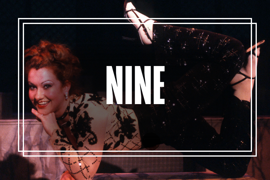 "Nine" in white text overlaying a photo of Musical Theatre students performing.