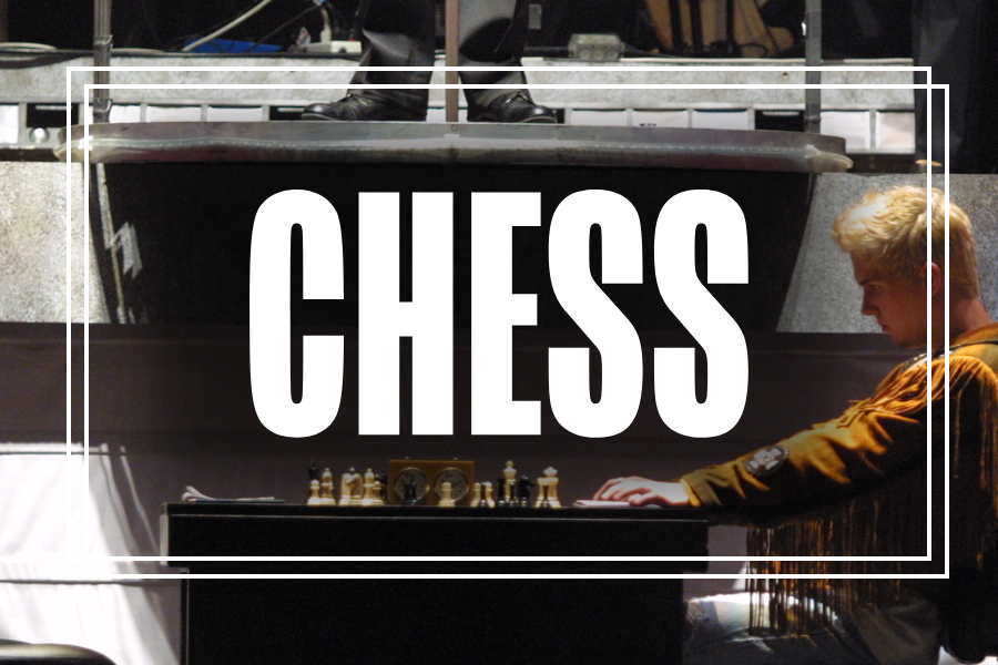 "Chess" in white text overlaying a photo of Musical Theatre students performing.