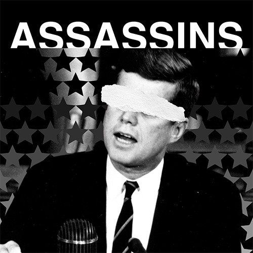 Black and white image of President John F. Kennedy with paper covering his eyes. The background contains black and gray stars. The word Assassins is displayed in white text.