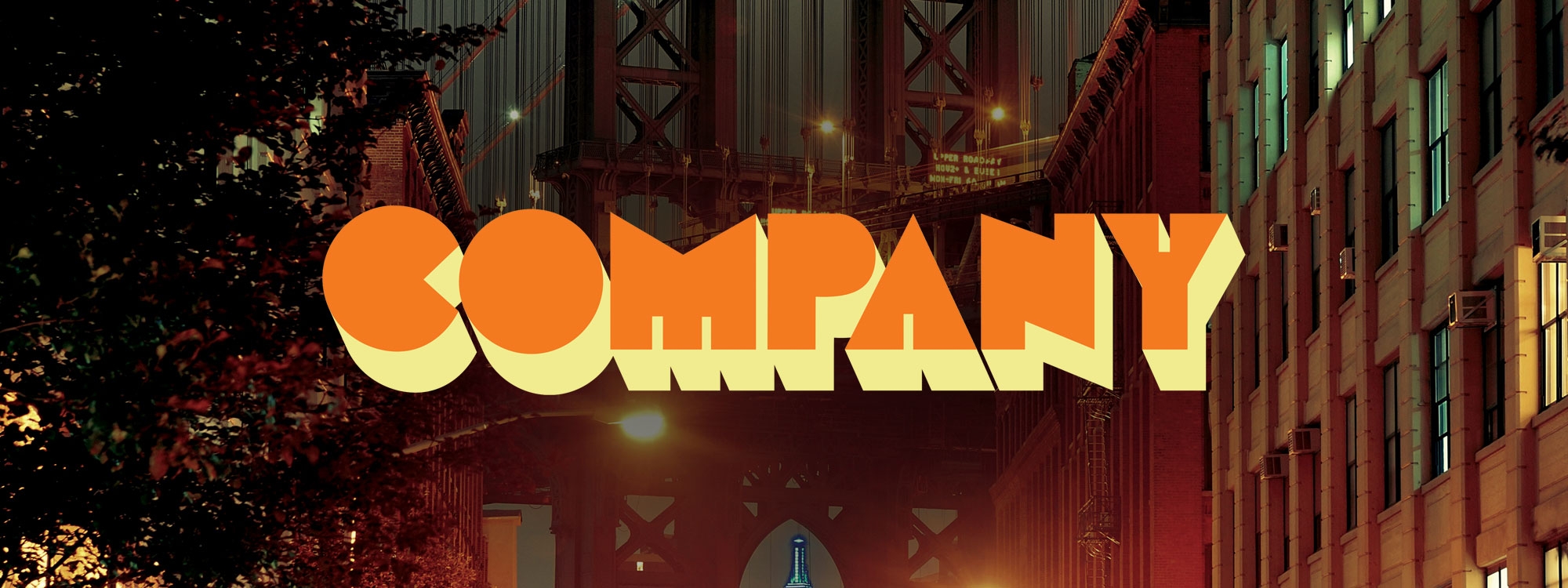 A neon sign that says "Company" in blue overlaying downtown New York City.