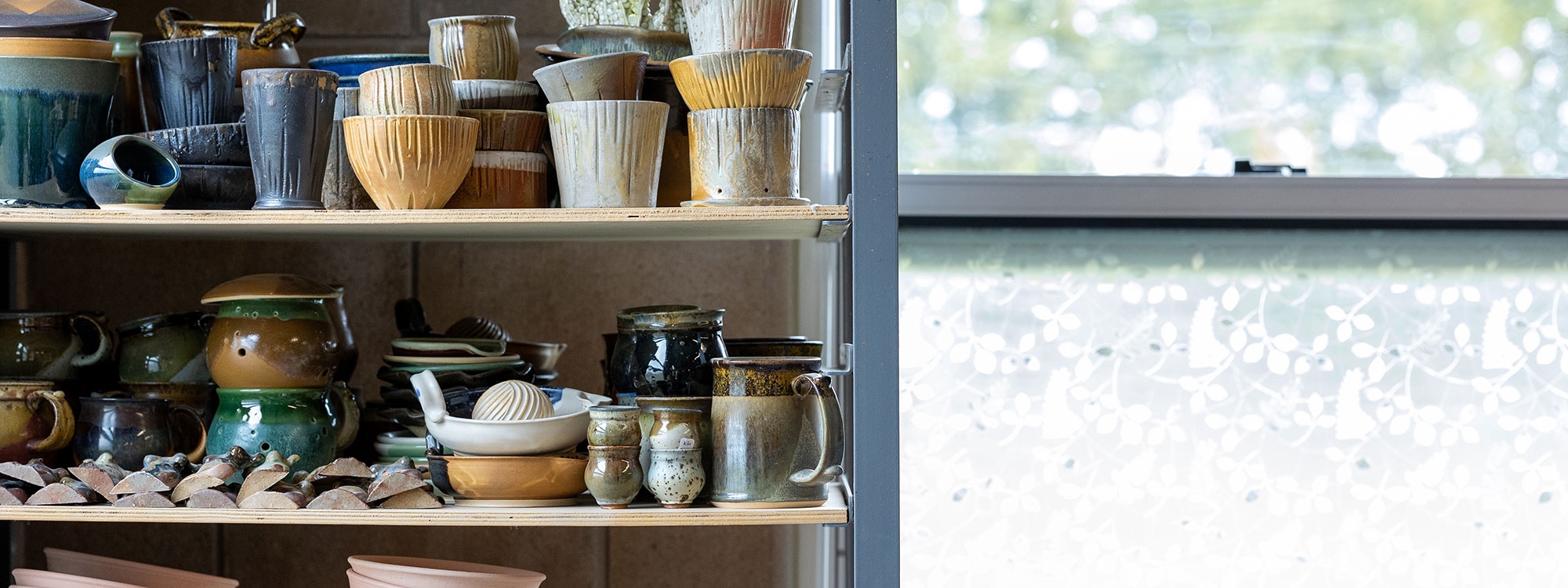 Ceramics on a shelf.