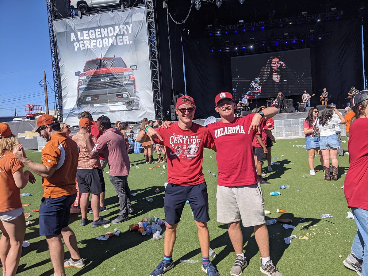 Harry and Adam displaying "horns down" while at pre OU-Texas game event.