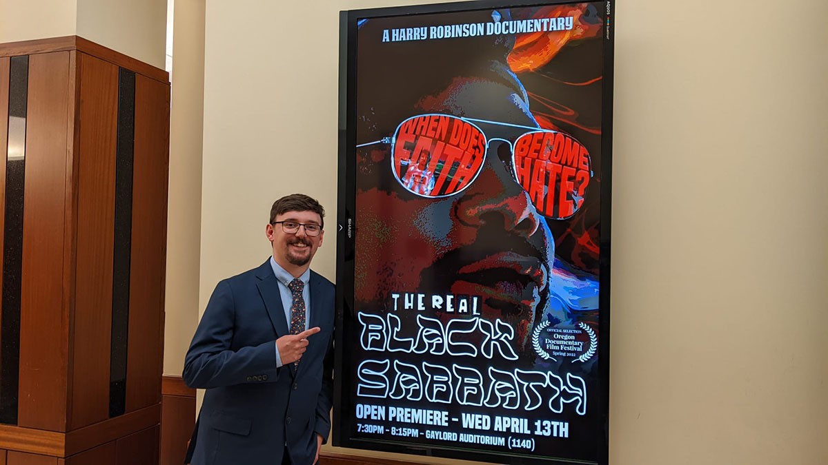 Harry pointing at movie poster.