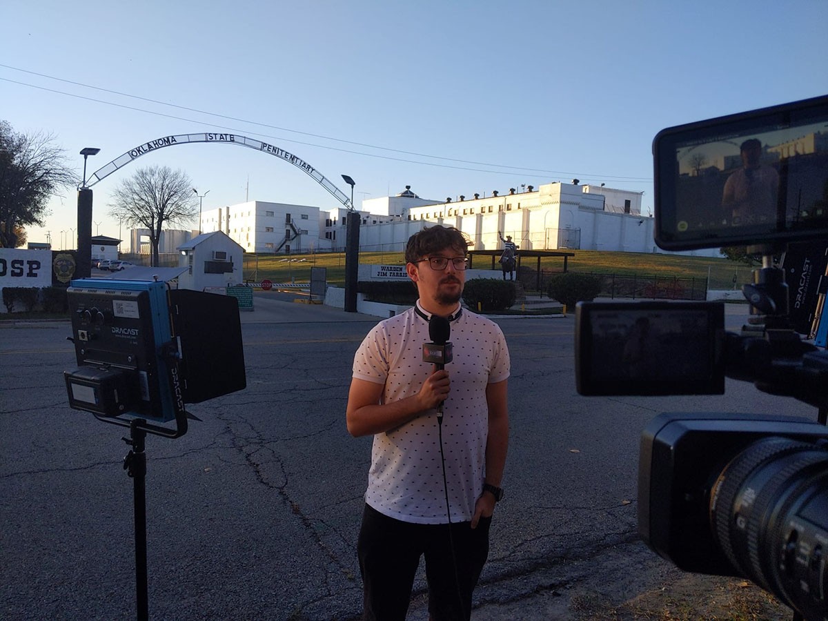 Harry reporting outdoors.