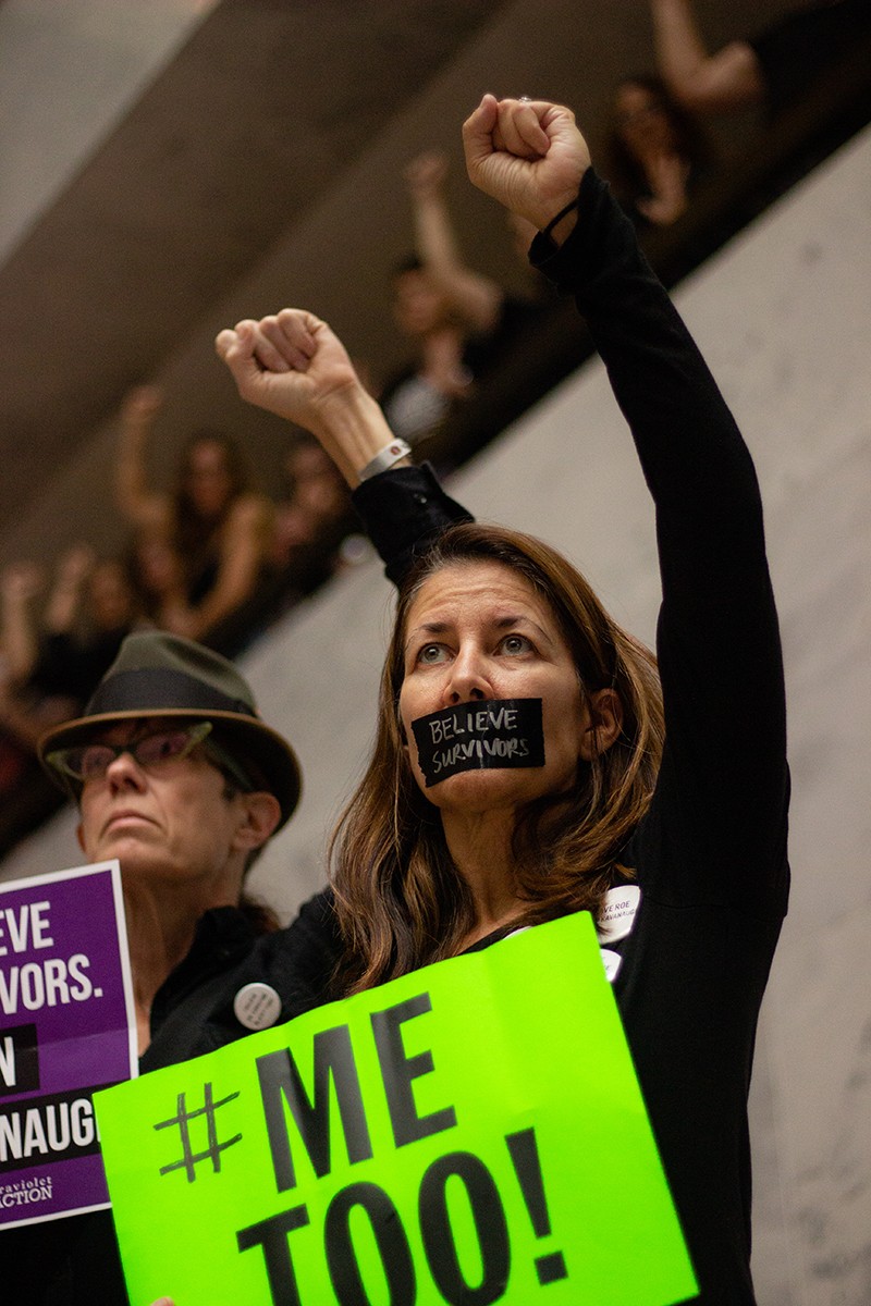 Demonstrators gather in Hart Senate Office Building during Christine Blasey Ford’s testimony before the Senate Judiciary Committee. (Megan Ross / Gaylord News)