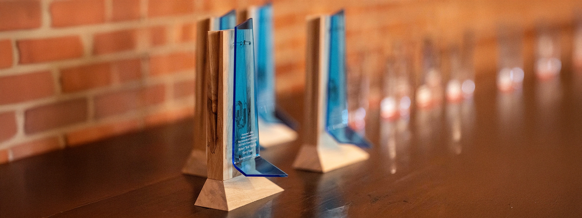 Gibbs College Hall of Fame awards on a mantle.