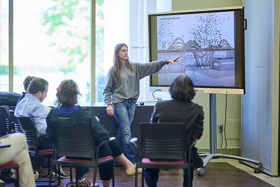 Wooden planks bolted together in a roof design.