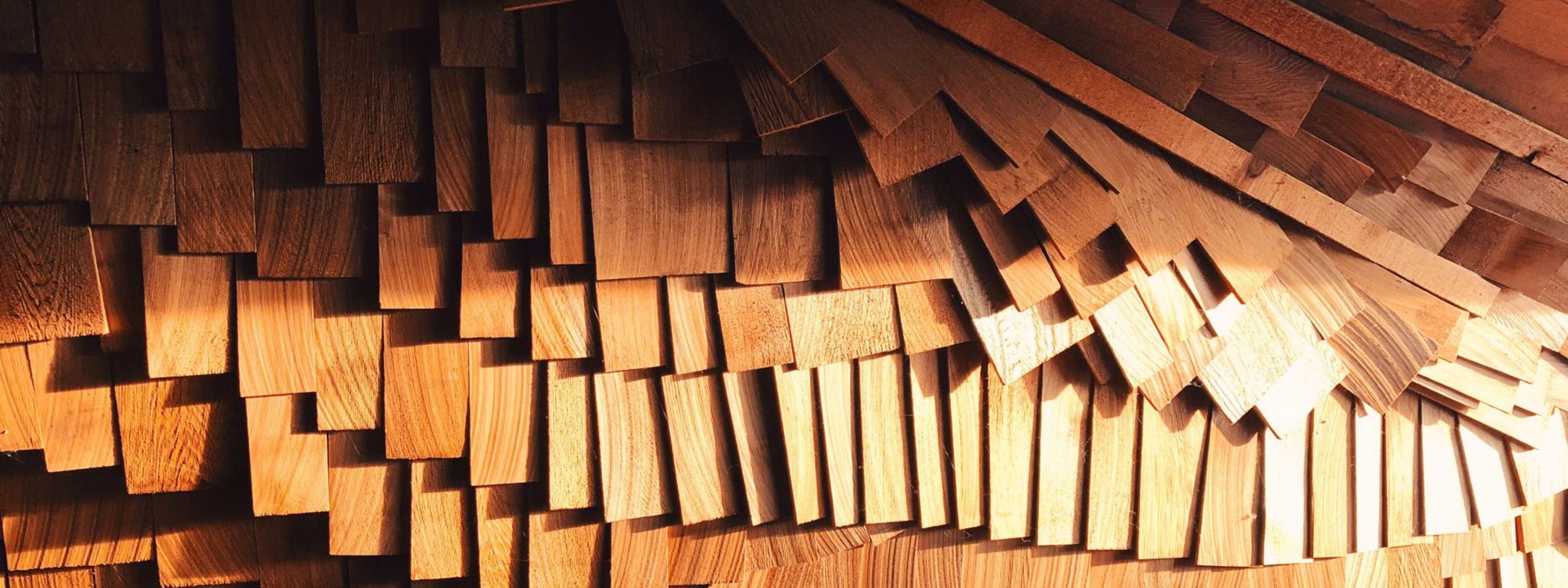 Panels of wood in cascading layers.