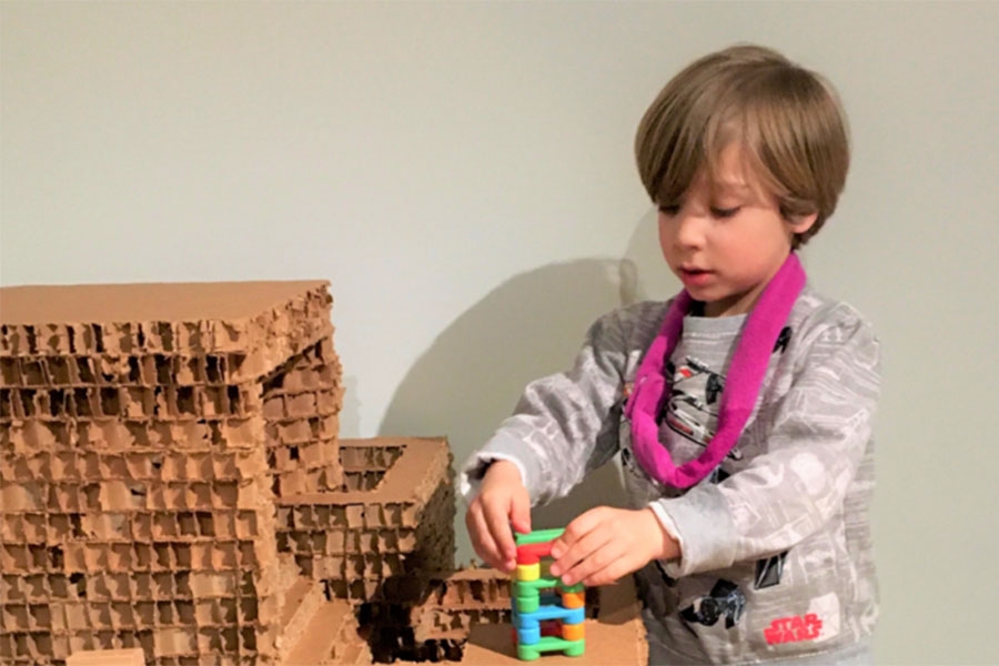 A child playing with building blocks.