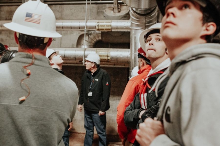 Students in hard hats at a power plant.