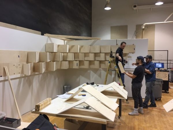 Students and faculty constructing the exhibit in the O U Creating and Making Lab.