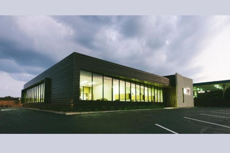 Render of a one story office building with windows along one side