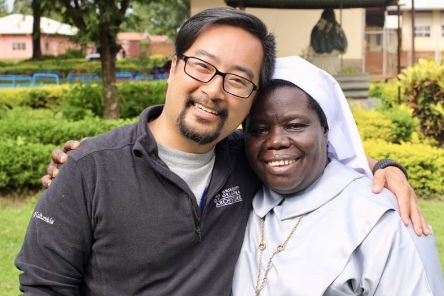 Christopher Lê and Rosemary Nyirumbe posing for a photo