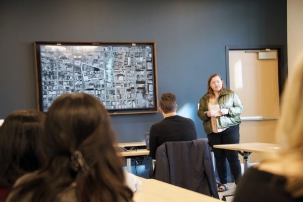 A student showing a slide with the site boundary for their project.