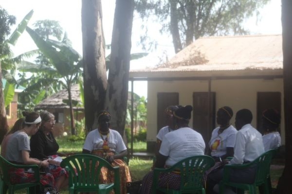 A group sitting in a circle conducting a focus group session