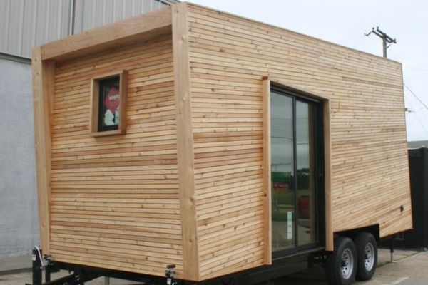 A wood tiny home on a trailer