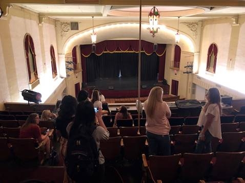 Students viewing the upper balcony section of the historic Woodward Theatre. 