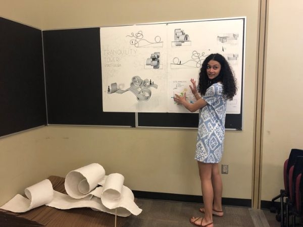 Kristi Saliba presenting a architectural poster. 