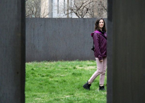 Katie Wing, seen through a doorway.