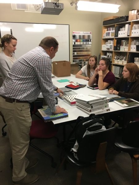 Students examine samples in the materials library.