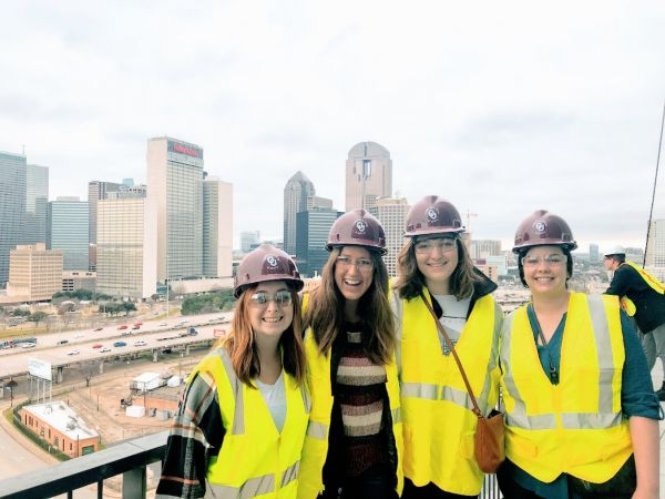 O U students in hard hats and hi-vis vests.