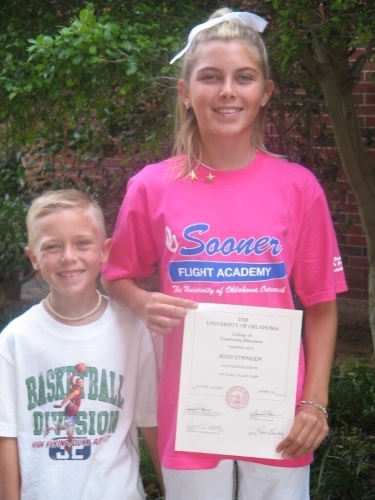 Marshall Stringer and Jessi Stringer with an award. 