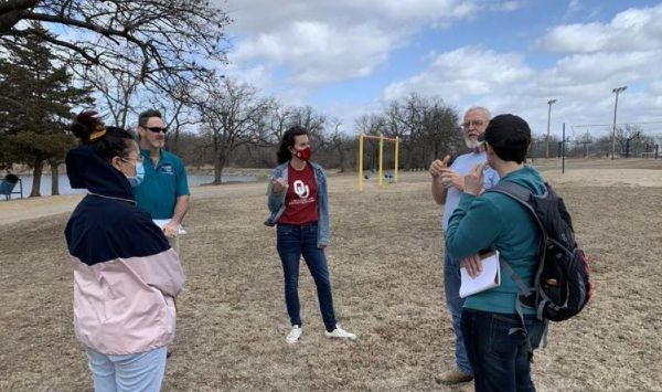 A group of people in a park in Stroud, Oklahoma.