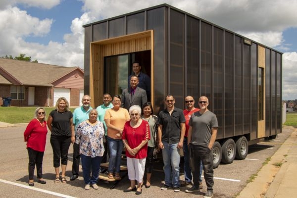 Group picture outside mobile medical unit of people who worked on the project including with OU Faculty and tribal members.