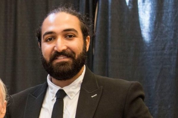 A headshot of Kayarash Karami.