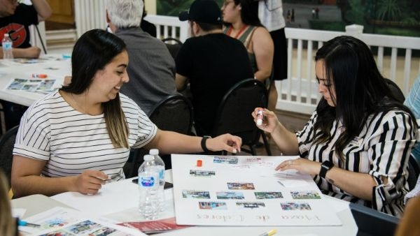 Sonia Ramirez working with stakeholders from the Capitol Hill district in Oklahoma City.