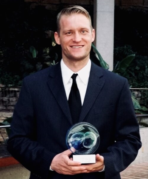 Matthew Crownover with his award from the Oklahoma A P A.