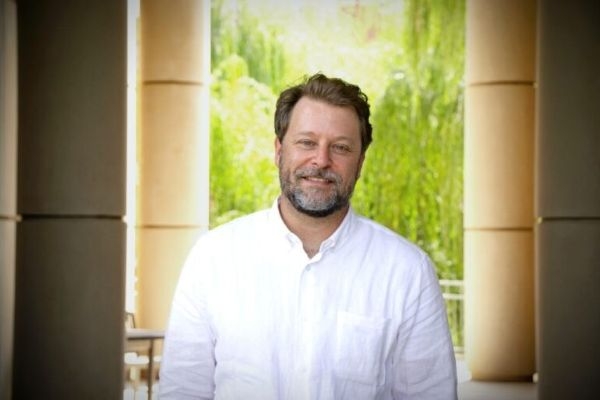 Brent Wall under the arch at Gould Hall.